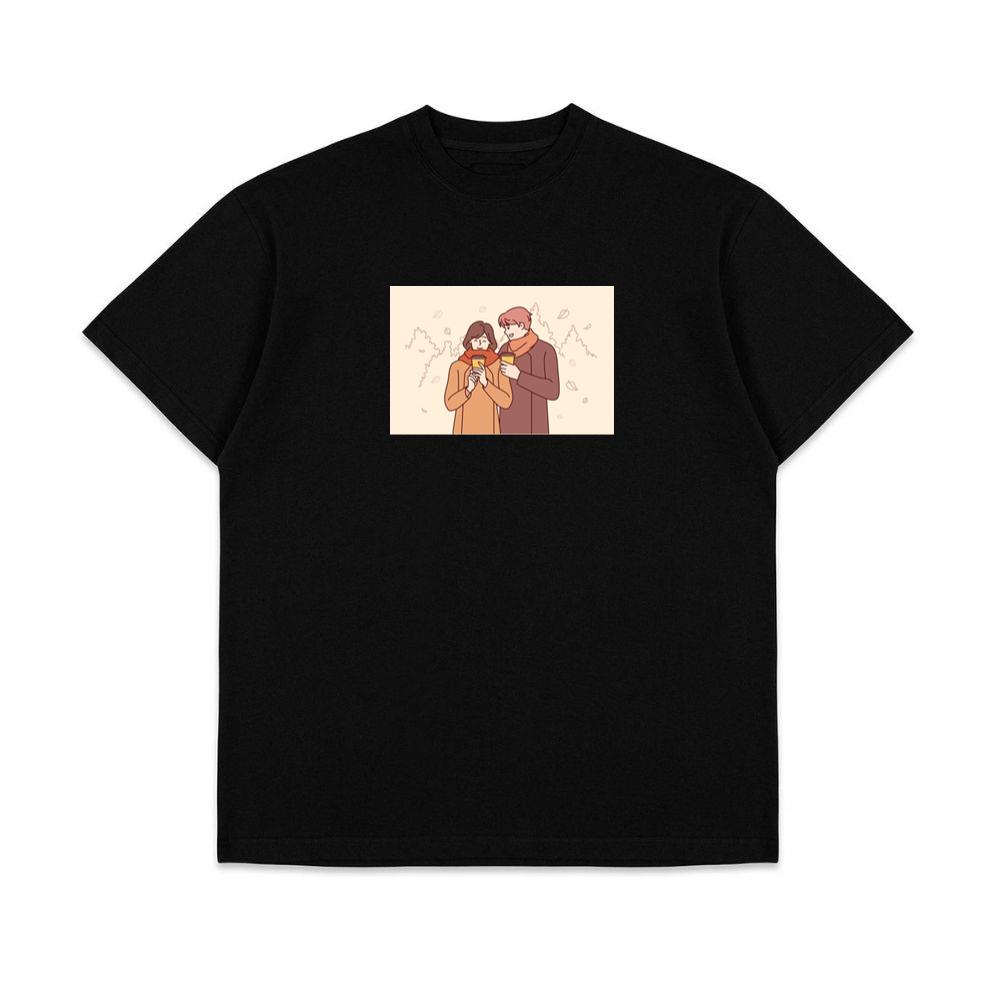 A Couple Enjoying a Cozy Moment Amidst Falling Leaves T-Shirts