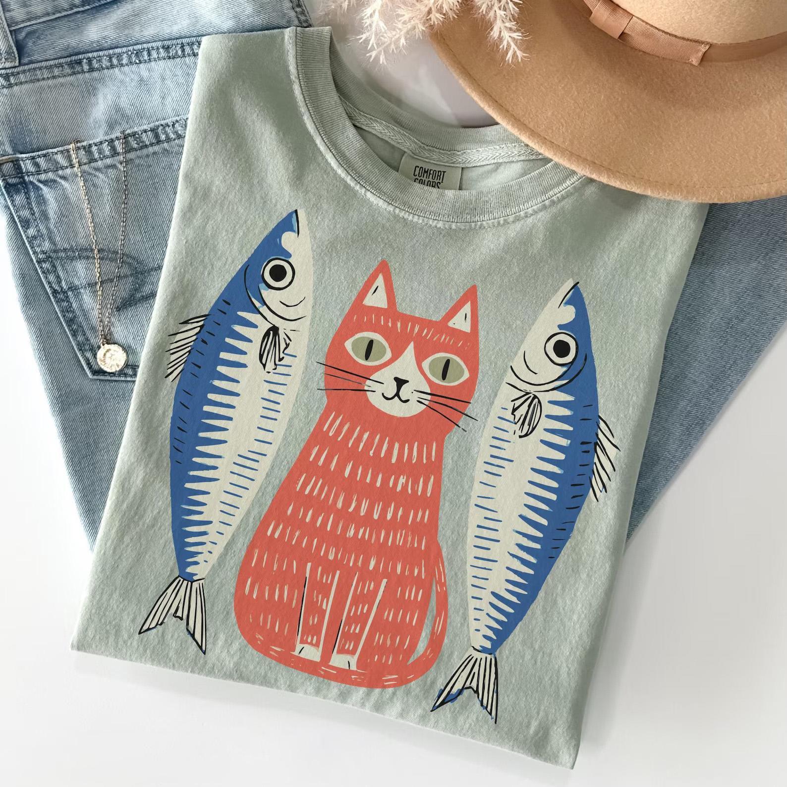 BojjiCo Sardines Cat Graphic T-Shirt Women's Retro 90s Folk Art Quirky Indie Aesthetic Blue Cotton Blend Funny Cat Fish Shirt Perfect Gift for Cat Lovers Vintage Cartoon Animal Tee Pet Gifts Cute Oversized Tops Casual Summer Apparel Graphic Shirts
