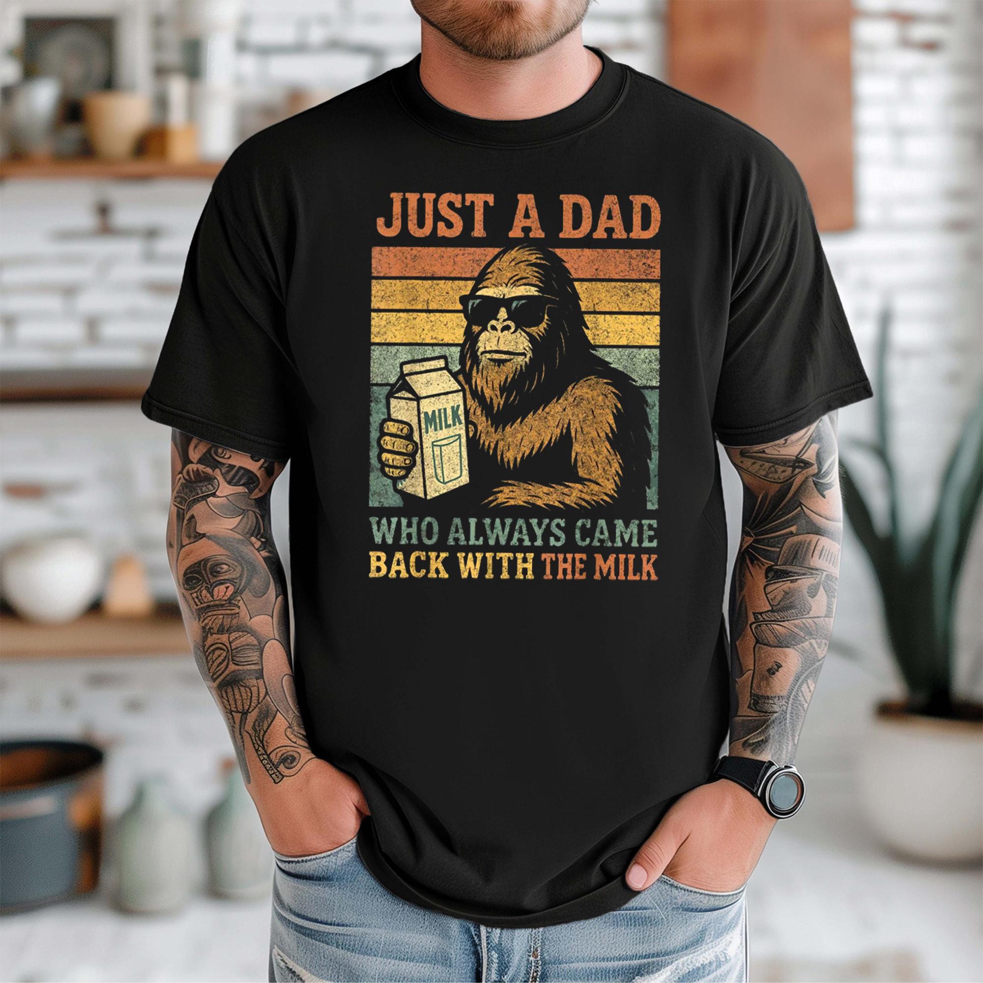 Just A Dad Who Always Came Back With The Milk Bigfoot Graphic T-Shirt Mens Fathers Retro Vintage Funny Dad Joke Black Cotton Tee Fathers Day Gift Sasquatch Novelty Casual Top Short Sleeve Summer Streetwear Clothing