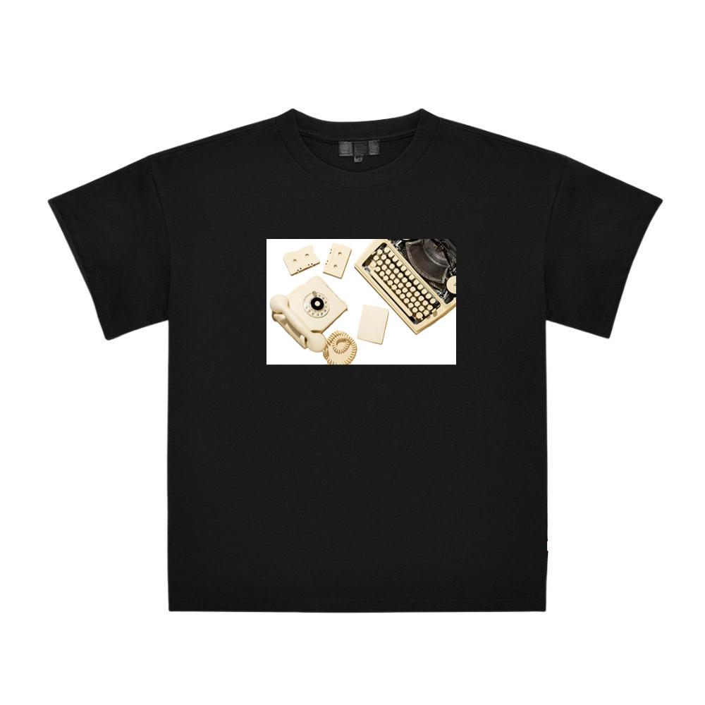 Vintage Yellow Telephone with Typewriter, Cassettes, and Paper T-Shirts