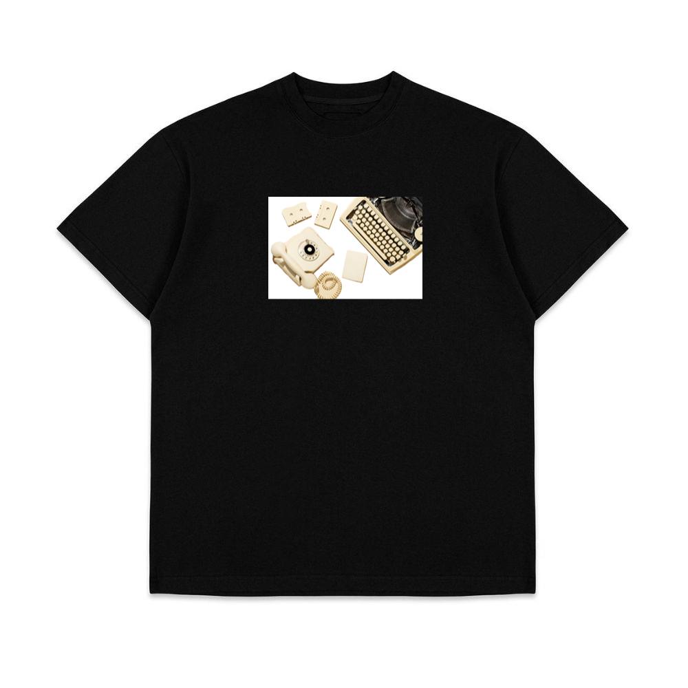 Vintage Yellow Telephone with Typewriter, Cassettes, and Paper T-Shirts