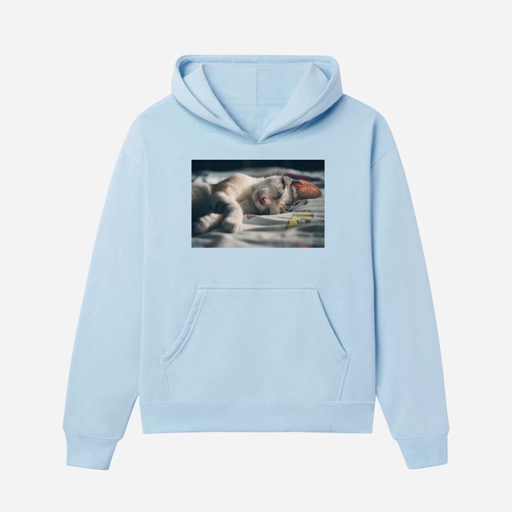 White Orange and Gray Tabby Cat Lying on Gray Textile Hoodies