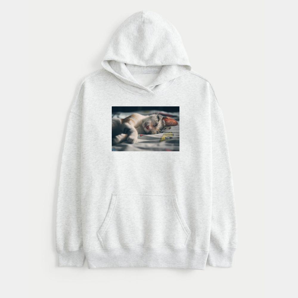 White Orange and Gray Tabby Cat Lying on Gray Textile Sweatshirt