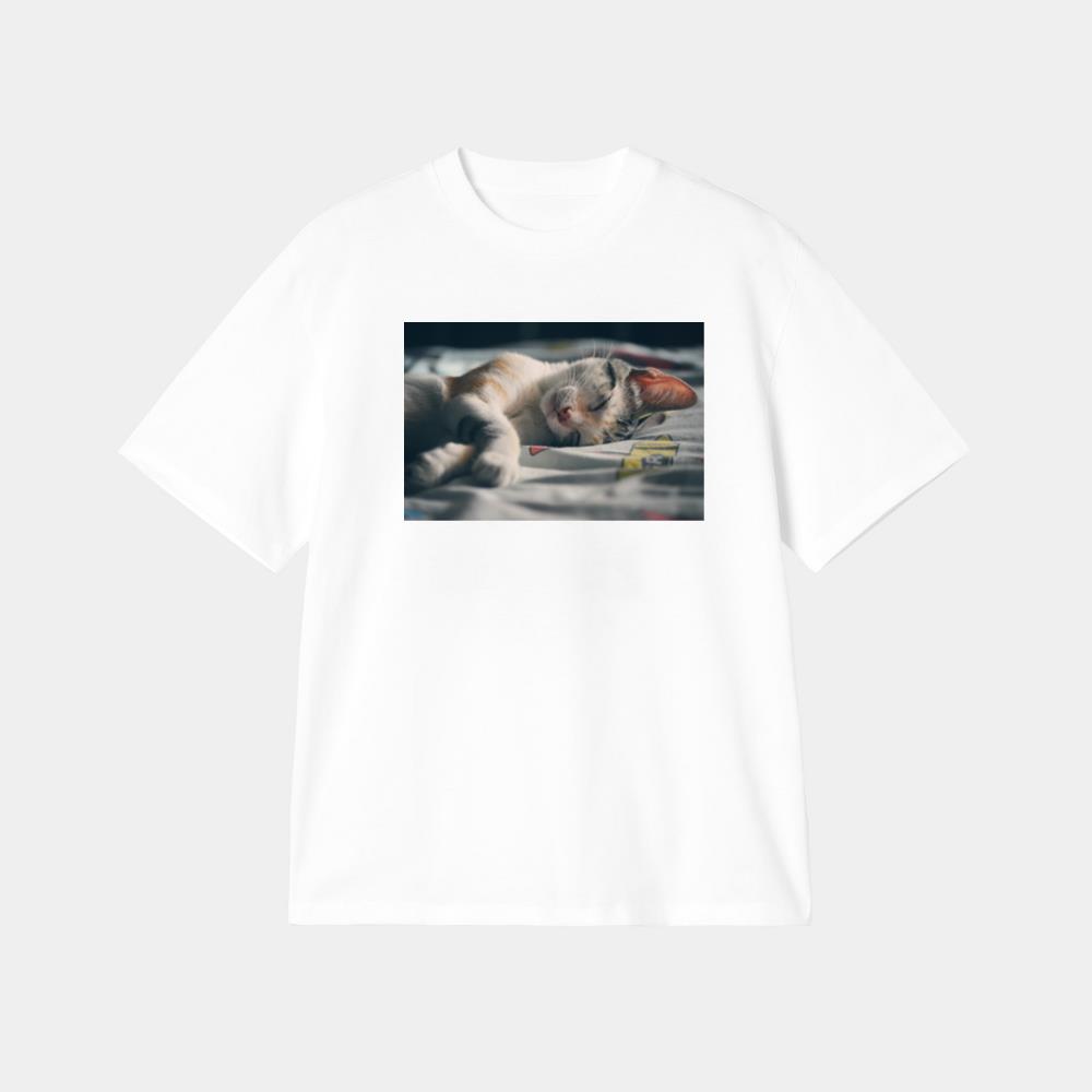 White Orange and Gray Tabby Cat Lying on Gray Textile T-Shirt